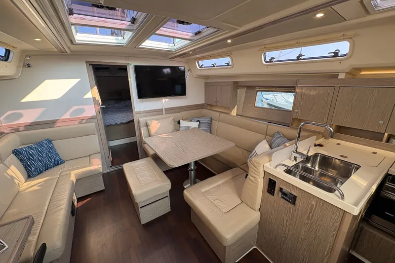 Slide: The Image of Luxurious interior of 2018 Hanse 455 yacht with modern seating and kitchen area. - 20