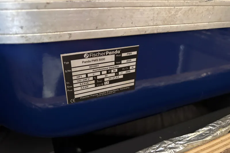 Slide: The Image of Label on Fischer Panda PMS 5000 generator, showing specifications and model details. - 33