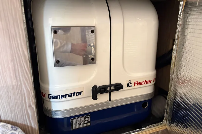 Slide: The Image of Fischer Panda generator inside a 2018 Hanse 455 yacht compartment. - 32