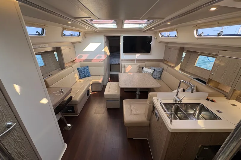 Slide: The Image of Luxurious interior of a 2018 Hanse 455 yacht with modern furnishings and ample natural light. - 19