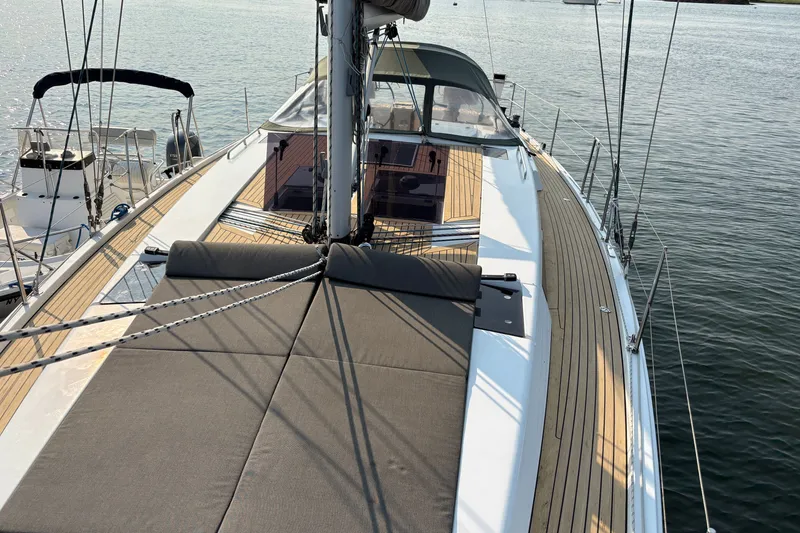 Slide: The Image of 2018 Hanse 455 yacht deck with sleek design and spacious layout on calm water. - 14