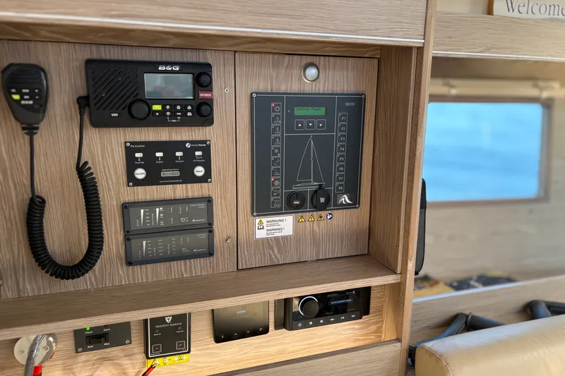 Slide: The Image of Control panel of a 2018 Hanse 455 yacht with navigation and communication equipment. - 31