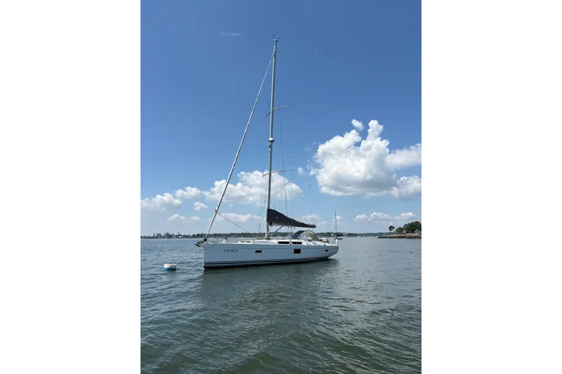 Slide: The Image of Sailing yacht Hanse 455 (2018) on calm water under a clear blue sky. - 5