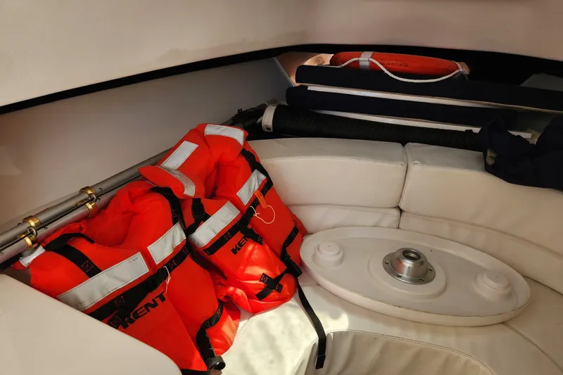 Slide: The Image of Interior of 2003 Intrepid 289 Walkaround with life jackets and safety equipment. - 31