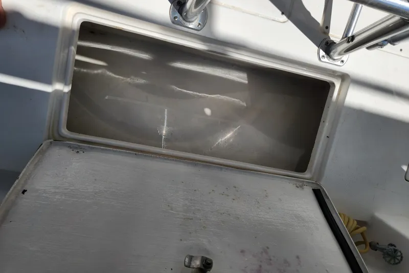 Slide: The Image of Open storage compartment on a 2003 Intrepid 289 Walkaround boat. - 43