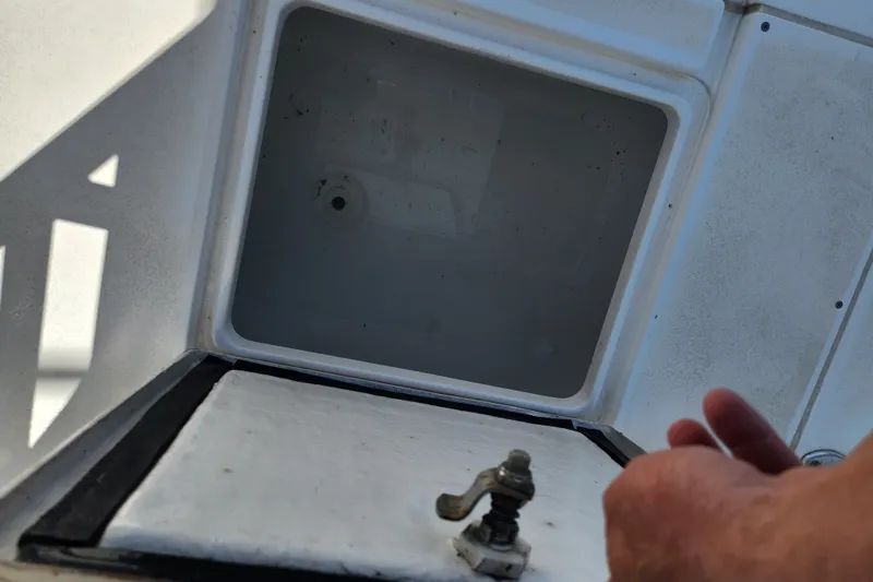 Slide: The Image of Open storage compartment on a 2003 Intrepid 289 Walkaround boat. - 42