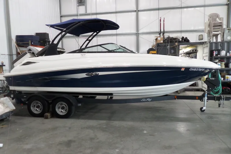 The Image of 2017 Sea Ray SDX 240 boat on trailer in indoor storage facility. - 0