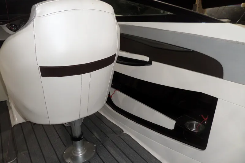 Slide: The Image of Interior of 2017 Sea Ray SDX 240 boat with white seating and dashboard. - 21