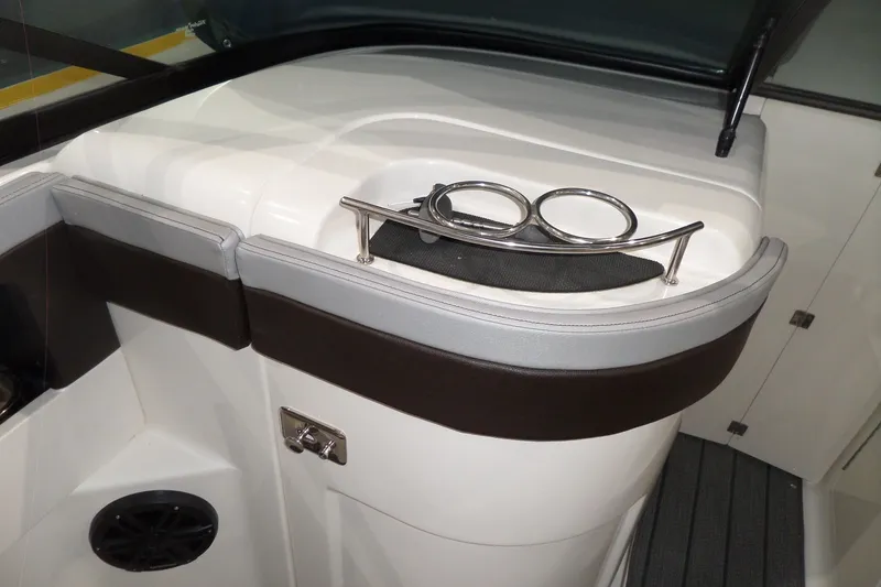 Slide: The Image of Interior of 2017 Sea Ray SDX 240 boat with cup holders and speaker. - 26