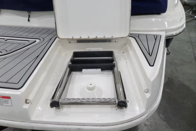 Slide: The Image of 2017 Sea Ray SDX 240 swim platform with retractable ladder. - 57