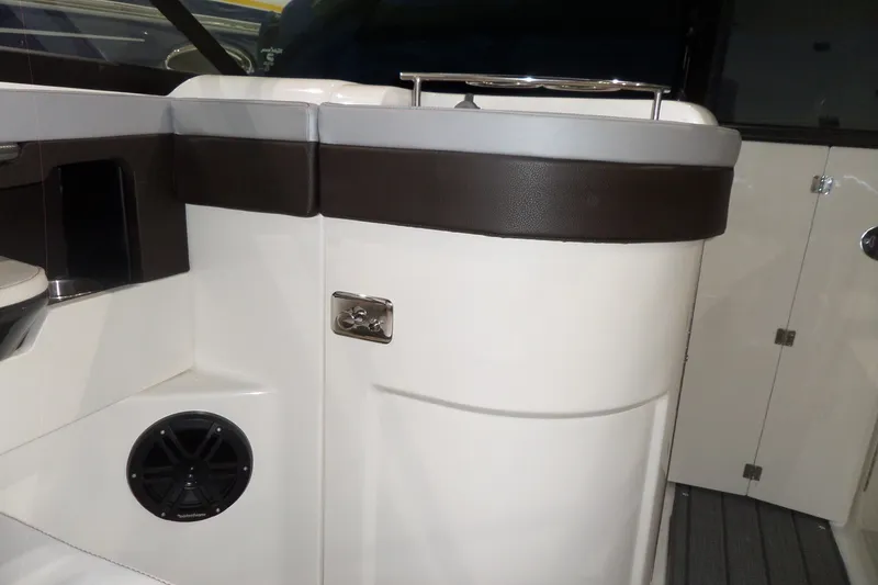 Slide: The Image of Interior view of a 2017 Sea Ray SDX 240 boat, featuring seating and speaker. - 27