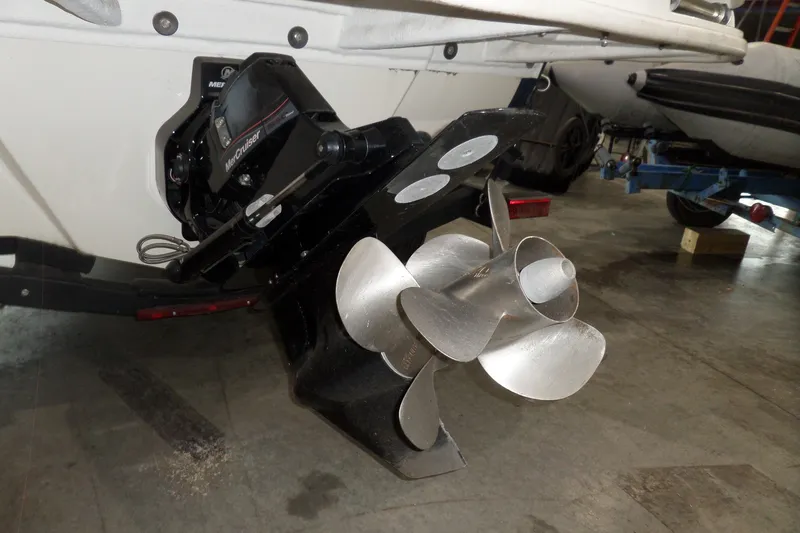 Slide: The Image of 2017 Sea Ray SDX 240 boat with MerCruiser outdrive and stainless steel propeller. - 58