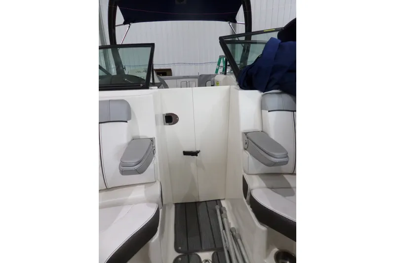 Slide: The Image of Interior view of a 2017 Sea Ray SDX 240 boat with seating and storage. - 45