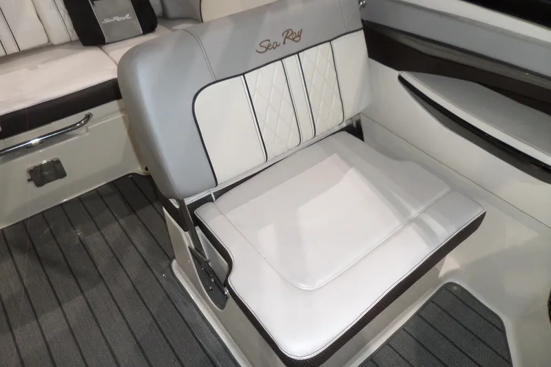 Slide: The Image of 2017 Sea Ray SDX 240 boat interior with cushioned seating and elegant design. - 24