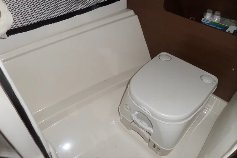 Slide: The Image of Compact marine toilet in 2017 Sea Ray SDX 240 boat interior. - 33
