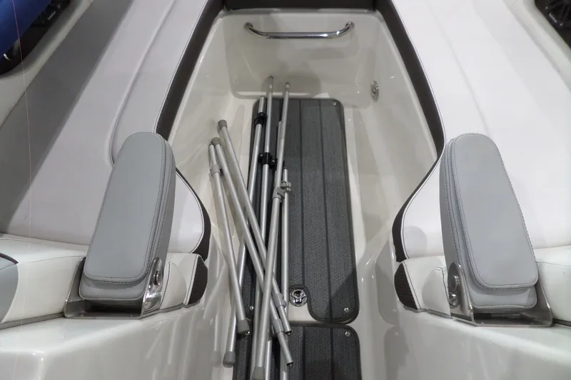 Slide: The Image of Interior view of a 2017 Sea Ray SDX 240 boat with folded metal poles. - 39