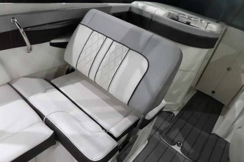 Slide: The Image of 2017 Sea Ray SDX 240 boat interior with cushioned seating and sleek design. - 25