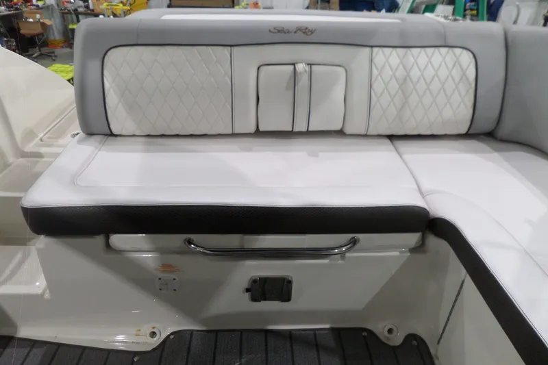 Slide: The Image of 2017 Sea Ray SDX 240 boat seating with white and black upholstery. - 19