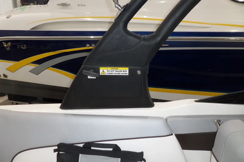 Slide: The Image of 2017 Sea Ray SDX 240 boat interior with caution label on tower. - 18