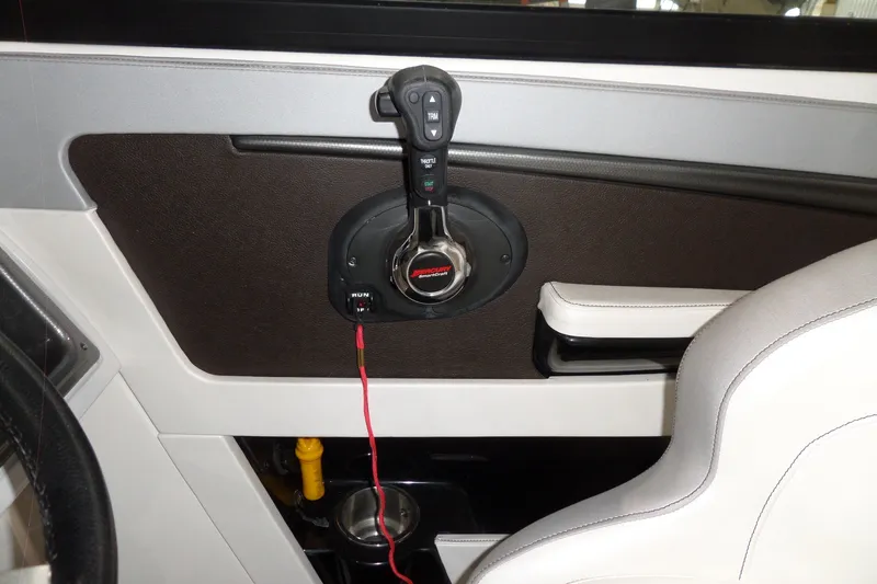 Slide: The Image of Interior of 2017 Sea Ray SDX 240 boat showing control panel and seating. - 31