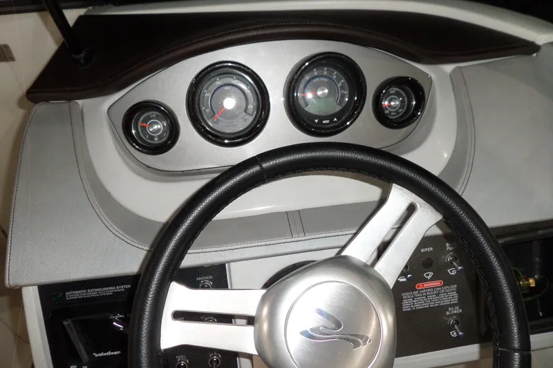 Slide: The Image of Dashboard of 2017 Sea Ray SDX 240 boat with steering wheel and gauges. - 29