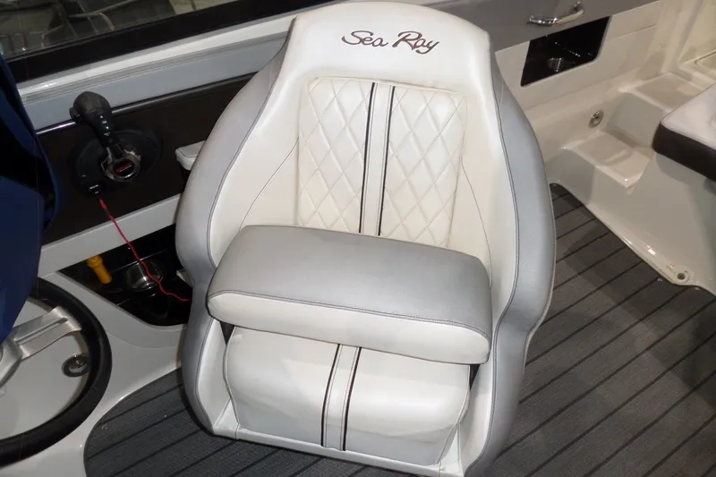 Slide: The Image of Captain's seat on 2017 Sea Ray SDX 240 boat with elegant upholstery design. - 56