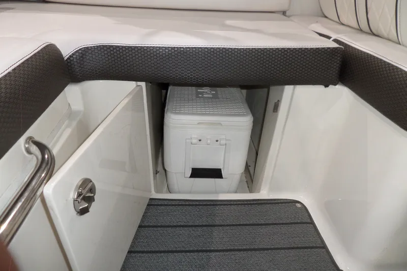 Slide: The Image of 2017 Sea Ray SDX 240 boat interior storage compartment with cooler. - 23