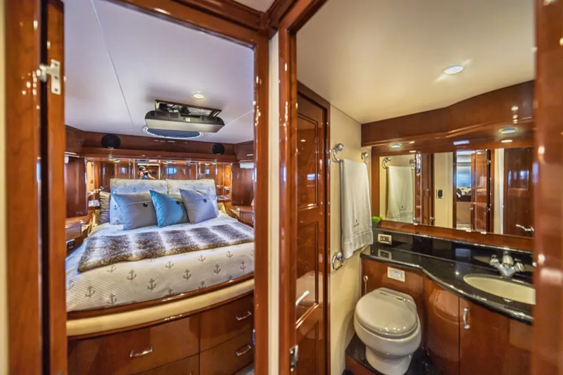 Slide: The Image of Luxurious 2004 Marquis 59 yacht interior with elegant bedroom and bathroom. - 63