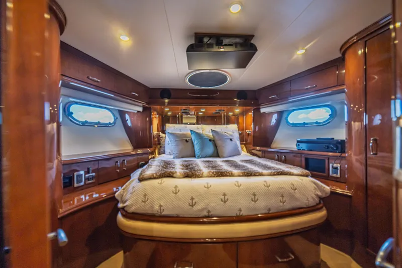 Slide: The Image of Luxurious cabin interior of a 2004 Marquis 59 yacht with elegant wood finishes. - 60