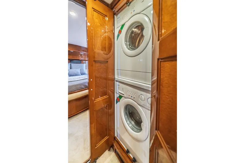 Slide: The Image of Stacked washer and dryer in 2004 Marquis 59 yacht interior. - 74