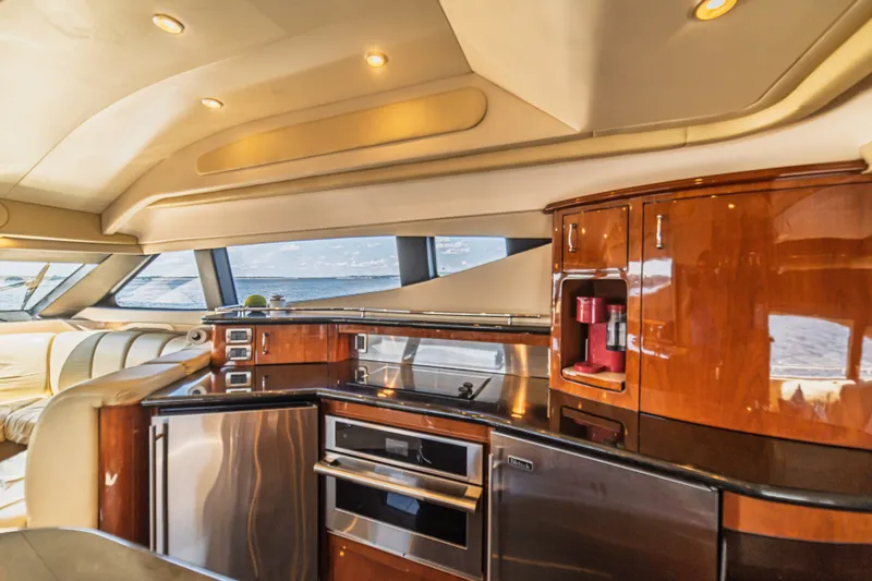 Slide: The Image of Luxurious interior of a 2004 Marquis 59 yacht with modern kitchen amenities. - 44