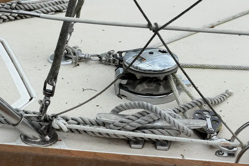 Slide: The Image of Deck rigging on a 1990 Sabre 34 MK II sailboat, featuring ropes and pulleys. - 7