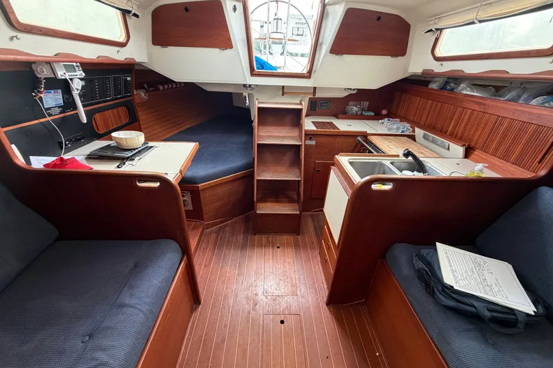 Slide: The Image of Interior of a 1990 Sabre 34 MK II sailboat with wood finish and seating area. - 27