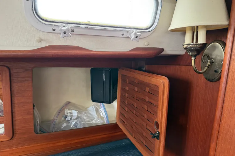 Slide: The Image of Interior of 1990 Sabre 34 MK II yacht with wooden cabinetry and wall lamp. - 48