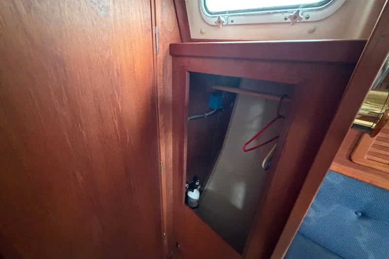 Slide: The Image of Wooden interior closet on a 1990 Sabre 34 MK II sailboat. - 54