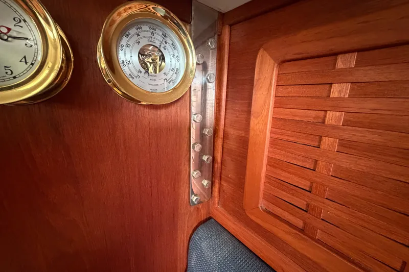 Slide: The Image of Interior of 1990 Sabre 34 MK II yacht with wooden paneling and brass instruments. - 50