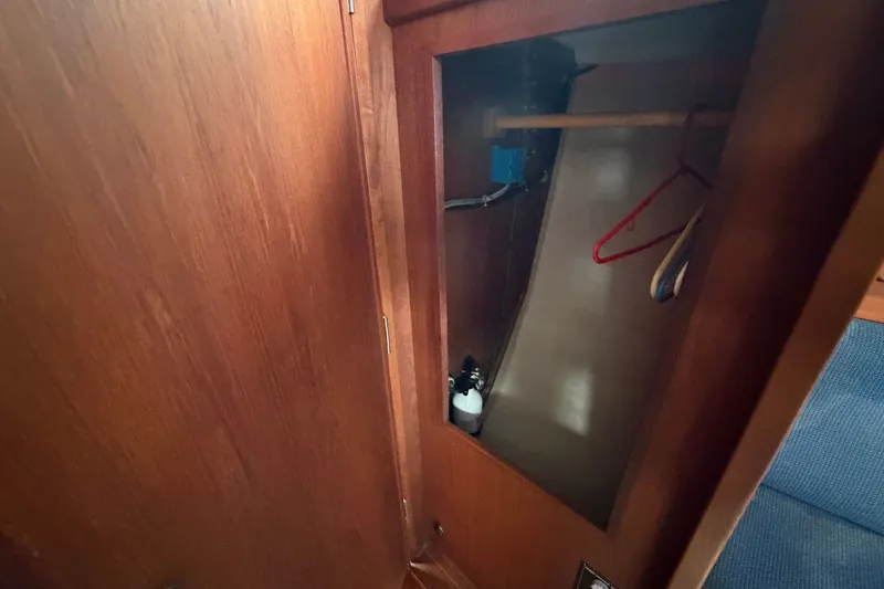 Slide: The Image of Wooden closet interior on a 1990 Sabre 34 MK II sailboat. - 53