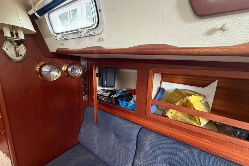 Slide: The Image of Interior of 1990 Sabre 34 MK II sailboat with wooden cabinetry and nautical instruments. - 43