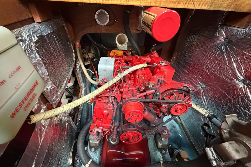 Slide: The Image of Engine compartment of 1990 Sabre 34 MK II sailboat with red Westerbeke diesel engine. - 65