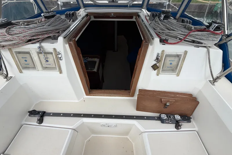 Slide: The Image of Cockpit view of a 1990 Sabre 34 MK II sailboat with ropes and hatch. - 24