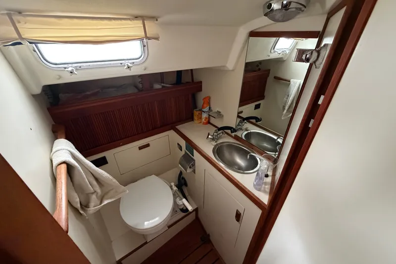 Slide: The Image of Bathroom interior of 1990 Sabre 34 MK II yacht with sink and toilet. - 58
