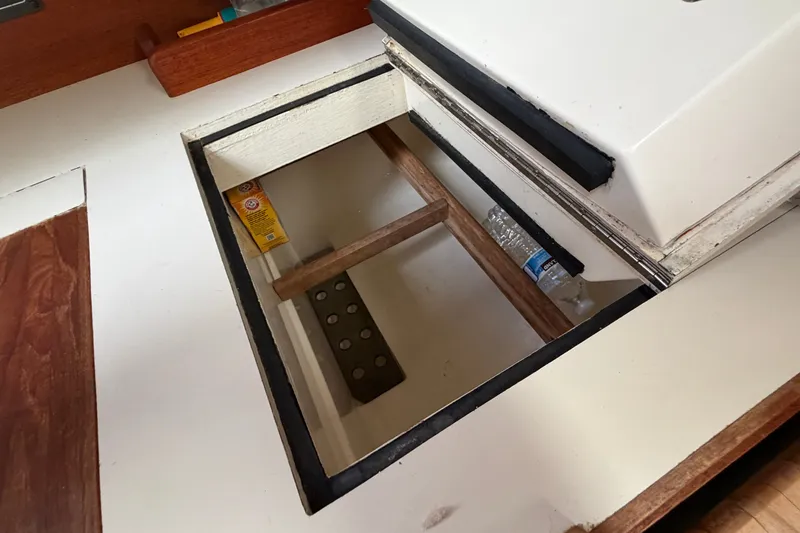 Slide: The Image of Open storage compartment in 1990 Sabre 34 MK II sailboat interior. - 32
