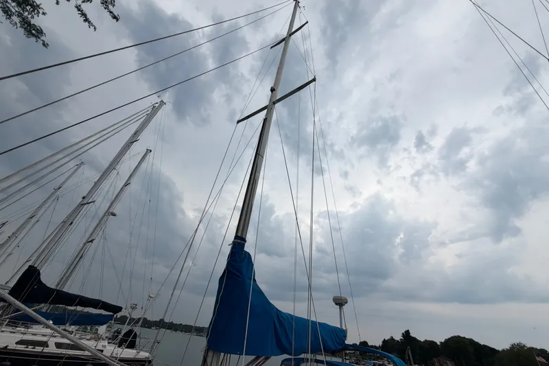 Slide: The Image of Sailboat mast of 1990 Sabre 34 MK II against cloudy sky. - 12