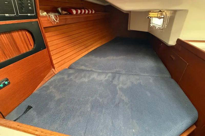 Slide: The Image of Cozy cabin interior of 1990 Sabre 34 MK II sailboat with blue cushions. - 41