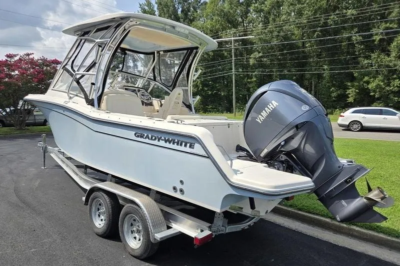 Slide: The Image of 2022 Grady-White Freedom 235 boat on trailer with Yamaha outboard motor. - 17