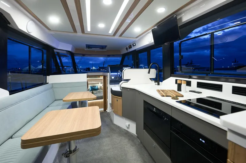 Slide: The Image of Luxurious interior of 2025 Northman 1300 yacht with modern kitchen and seating area. - 37