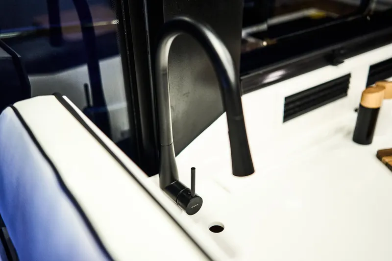 Slide: The Image of Modern black faucet on Northman 1300 yacht, 2025 model, sleek and stylish design. - 39