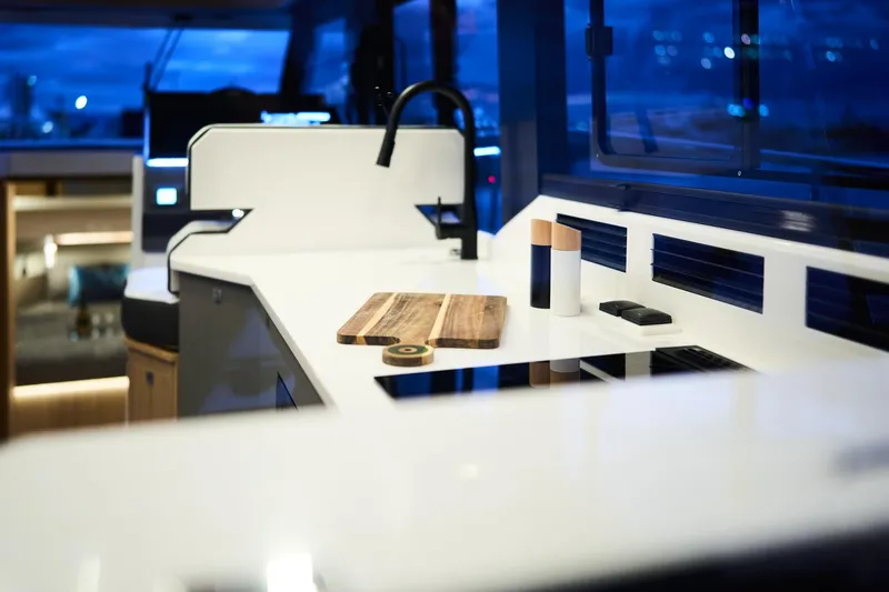 Slide: The Image of Modern kitchen interior of 2025 Northman 1300 yacht with sleek countertops and ambient lighting. - 36