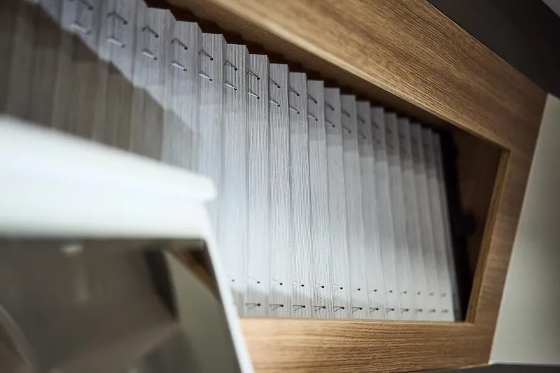 Slide: The Image of Pleated window blind in a Northman 1300, 2025 model, with wooden frame detail. - 43