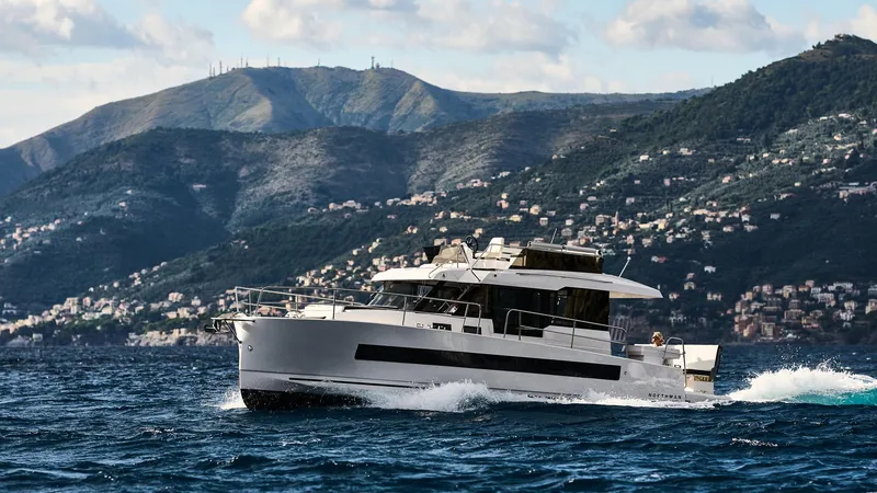 Slide: The Image of 2025 Northman 1300 yacht cruising on scenic coastal waters with mountainous backdrop. - 28